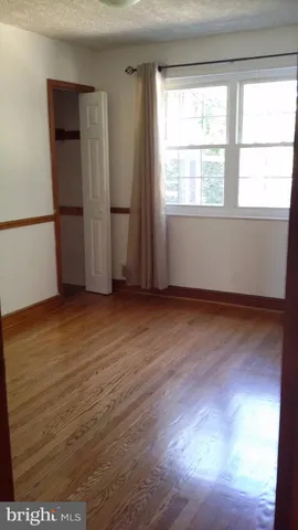 a brick building with a door and a window