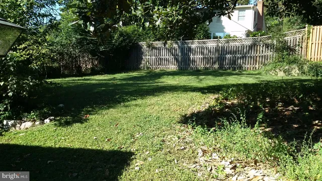 a view of a glass door and a yard