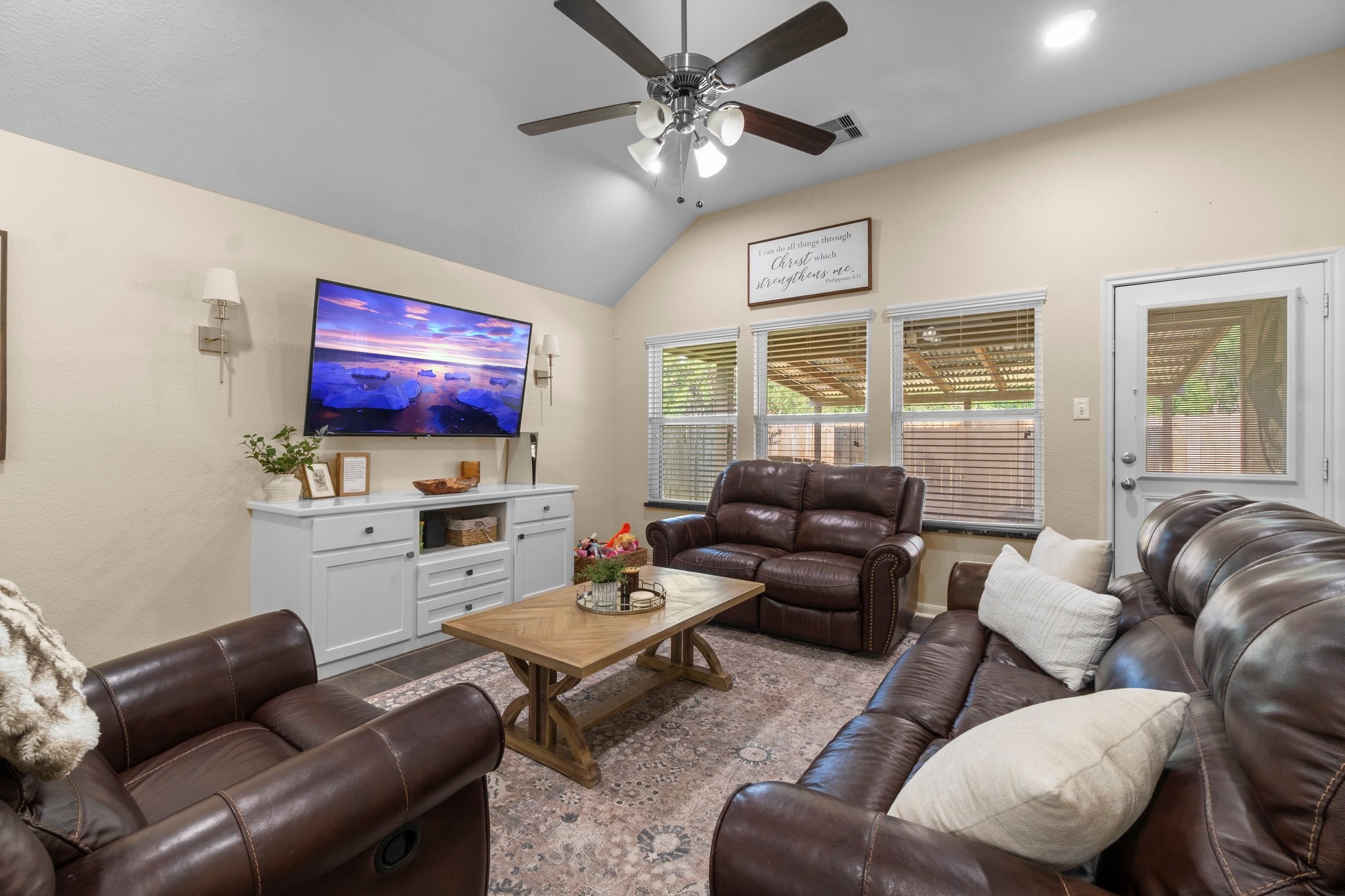 28987 Birch Green Way Spring, TX 77386 - Photo 12 of 32 a living room with furniture a large window and a flat screen tv