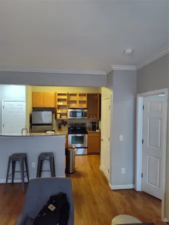 a living room with furniture and floor to ceiling window