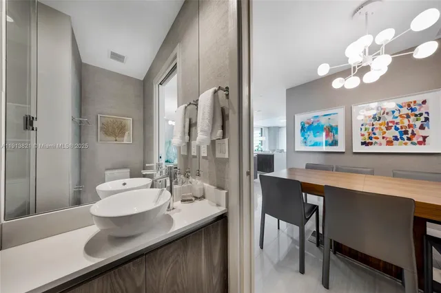 a bathroom with a sink a mirror and a bathtub