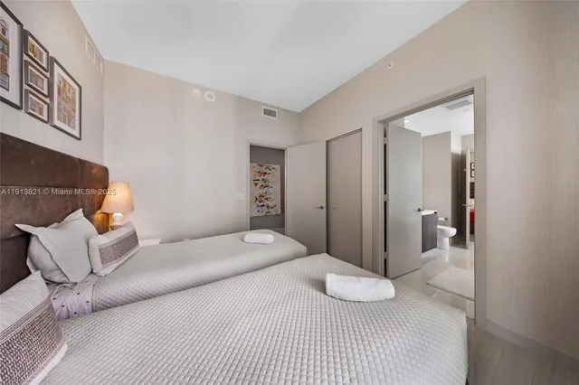 a bedroom with a bed and couch