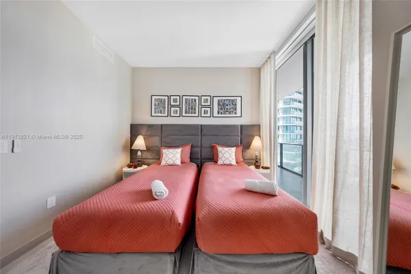 a bed room with a bed and a tv