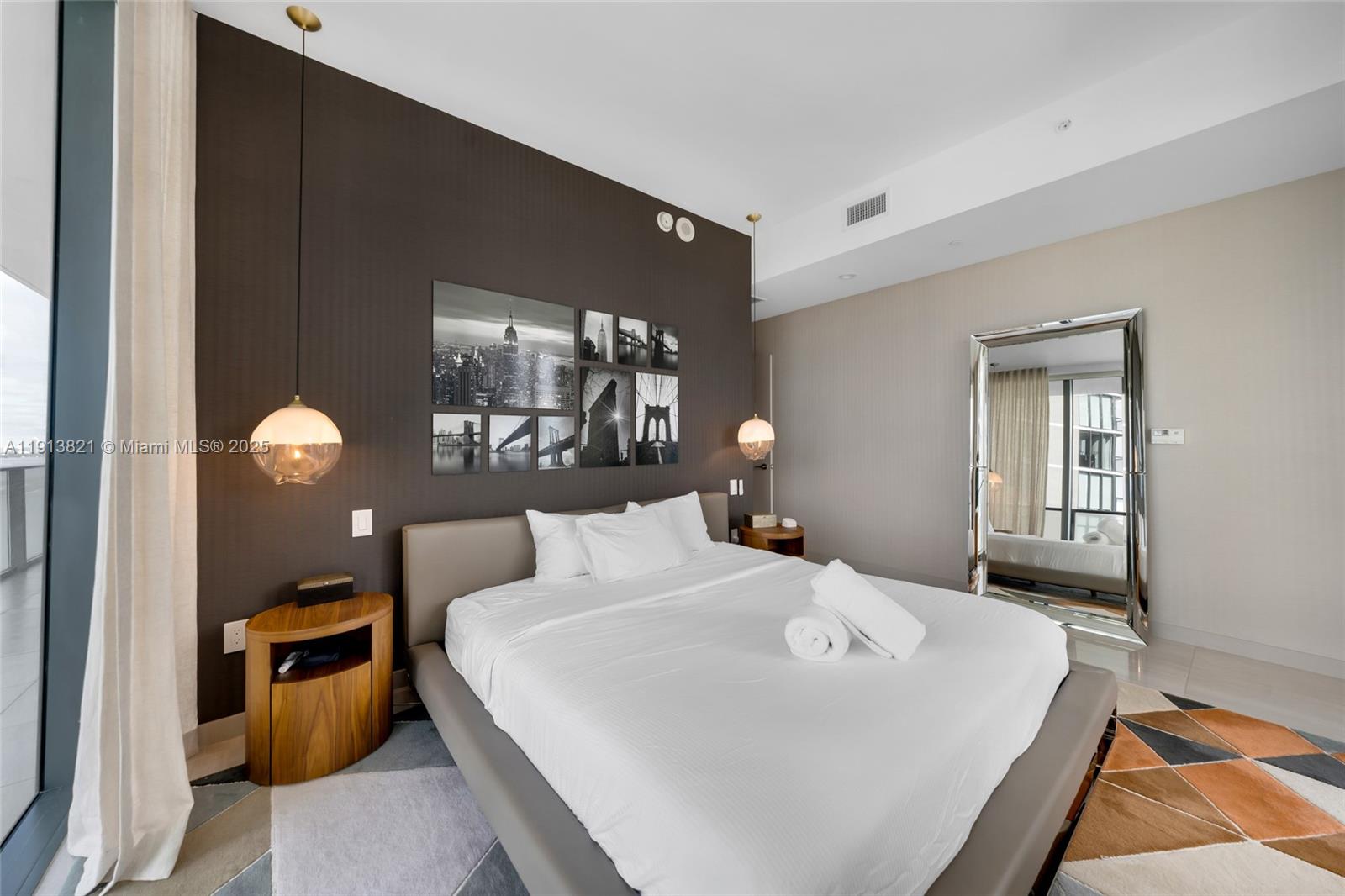 480 Northeast 31st Street, Unit 2807 Miami, FL 33137 - Photo 23 of 45 a bedroom with a bed and window