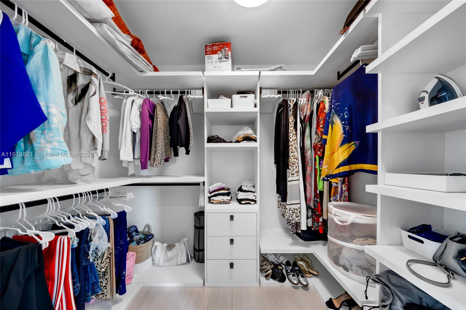 480 Northeast 31st Street, Unit 2807 Miami, FL 33137 - Photo 25 of 45 a view of walk in closet with clothes and shoes