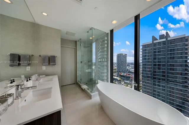 a bathroom with a toilet sink and shower