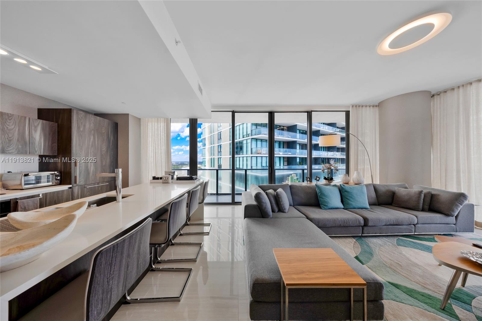 480 Northeast 31st Street, Unit 2807 Miami, FL 33137 - Photo 3 of 45 a living room with furniture and a large window