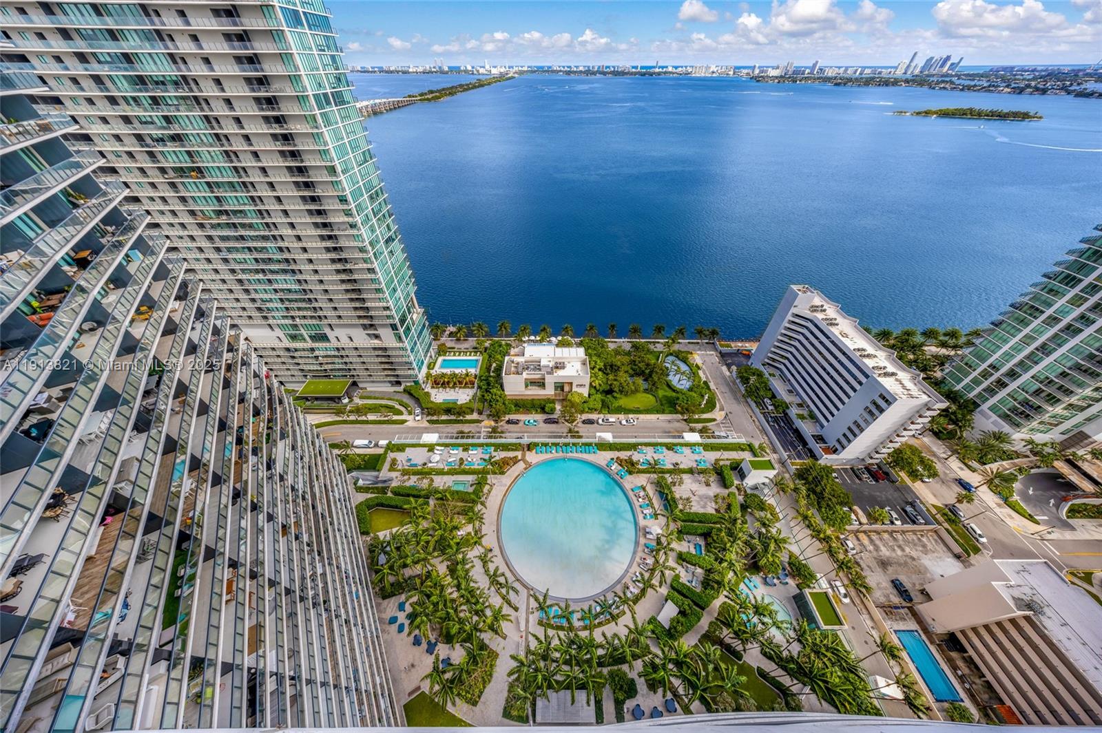 480 Northeast 31st Street, Unit 2807 Miami, FL 33137 - Photo 34 of 45 an aerial view of a house with a garden and lake view