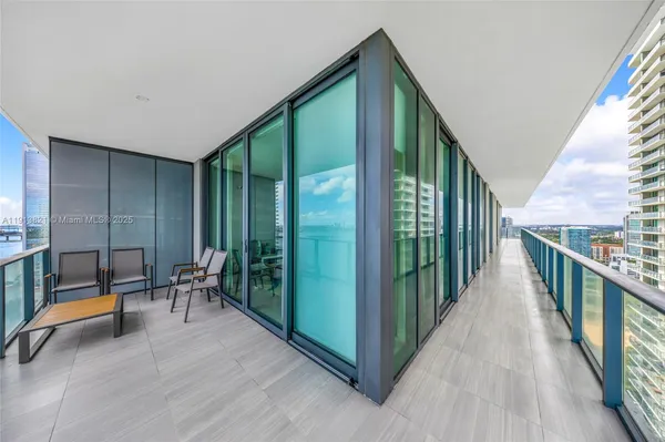 a view of balcony and yard