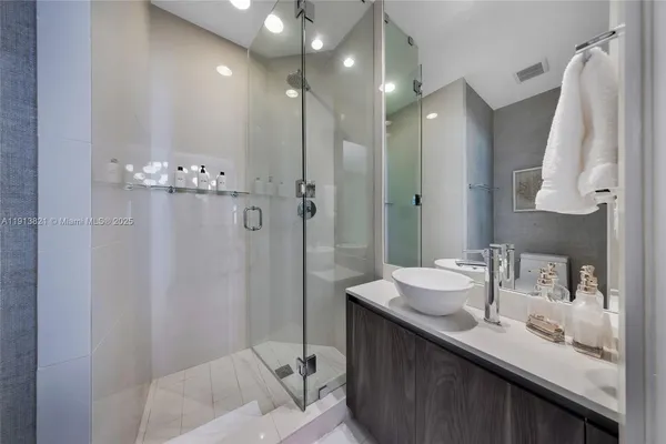a bathroom with a sink double vanity and a mirror