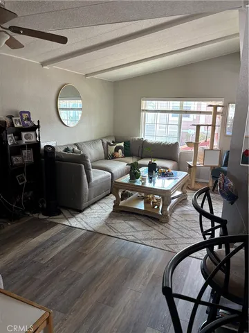 a view of a hallway view with wooden floor and furniture