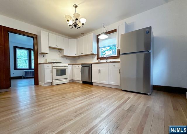 1156 High Mountain Road North Haledon, NJ 07508 - Photo 3 of 14 a kitchen with granite countertop a refrigerator and a stove top oven