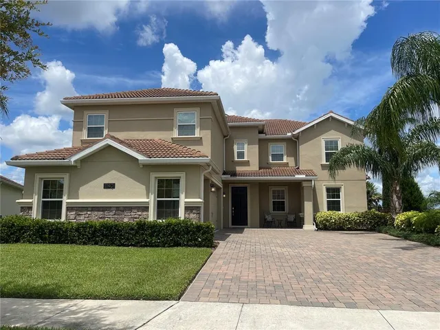 a view of a swimming pool with a patio