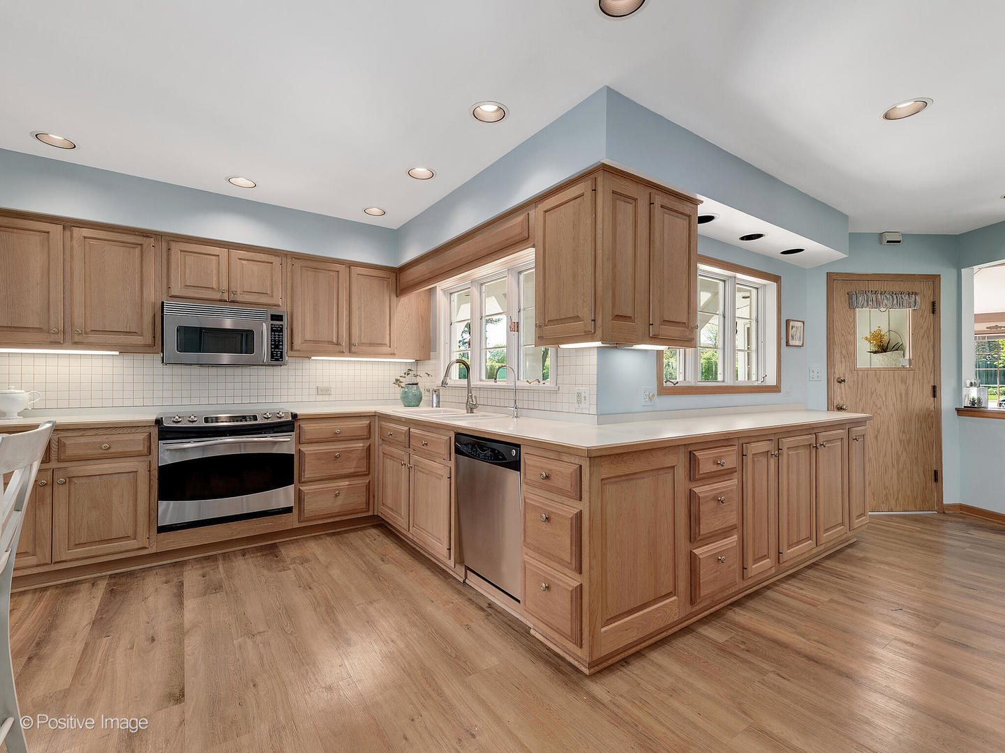 6401 South County Line Road Burr Ridge, IL 60527 - Photo 18 of 57 a kitchen with stainless steel appliances granite countertop a stove and a sink