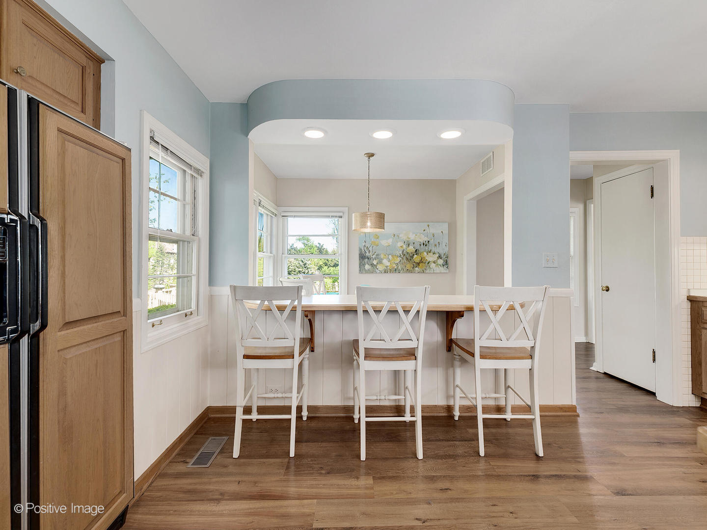 6401 South County Line Road Burr Ridge, IL 60527 - Photo 21 of 57 a dining room with furniture a window and wooden floor