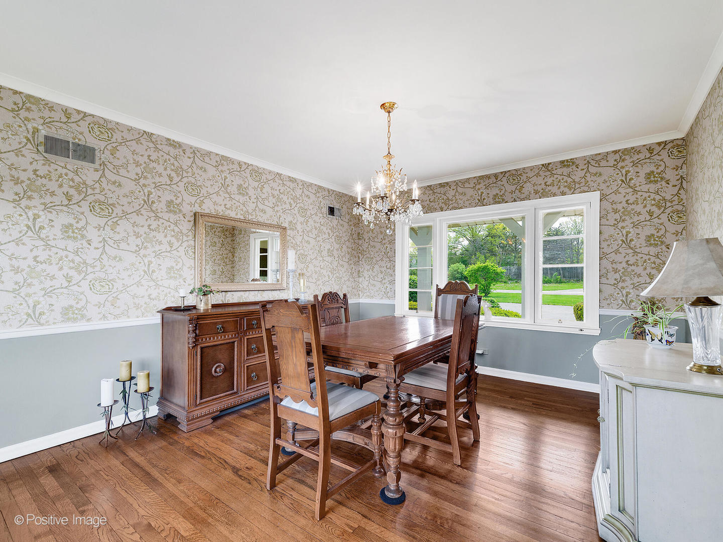 6401 South County Line Road Burr Ridge, IL 60527 - Photo 22 of 57 a dining room with furniture a chandelier and wooden floor