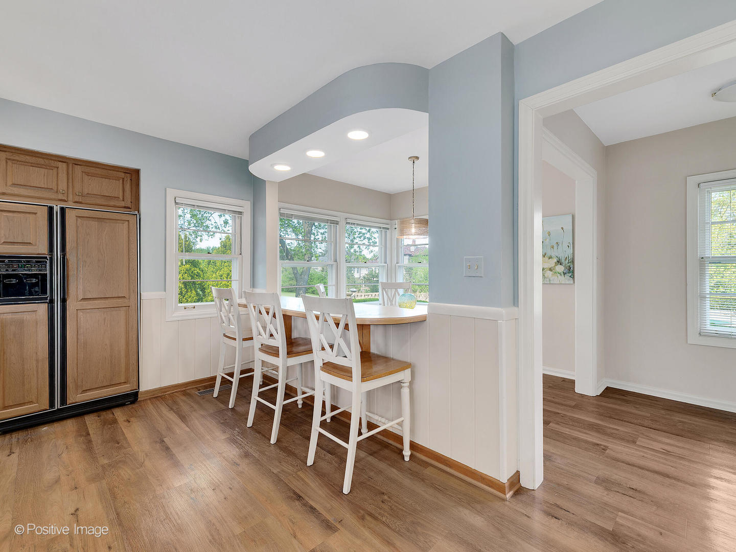 6401 South County Line Road Burr Ridge, IL 60527 - Photo 26 of 57 a dining room with furniture window wooden floor and a kitchen
