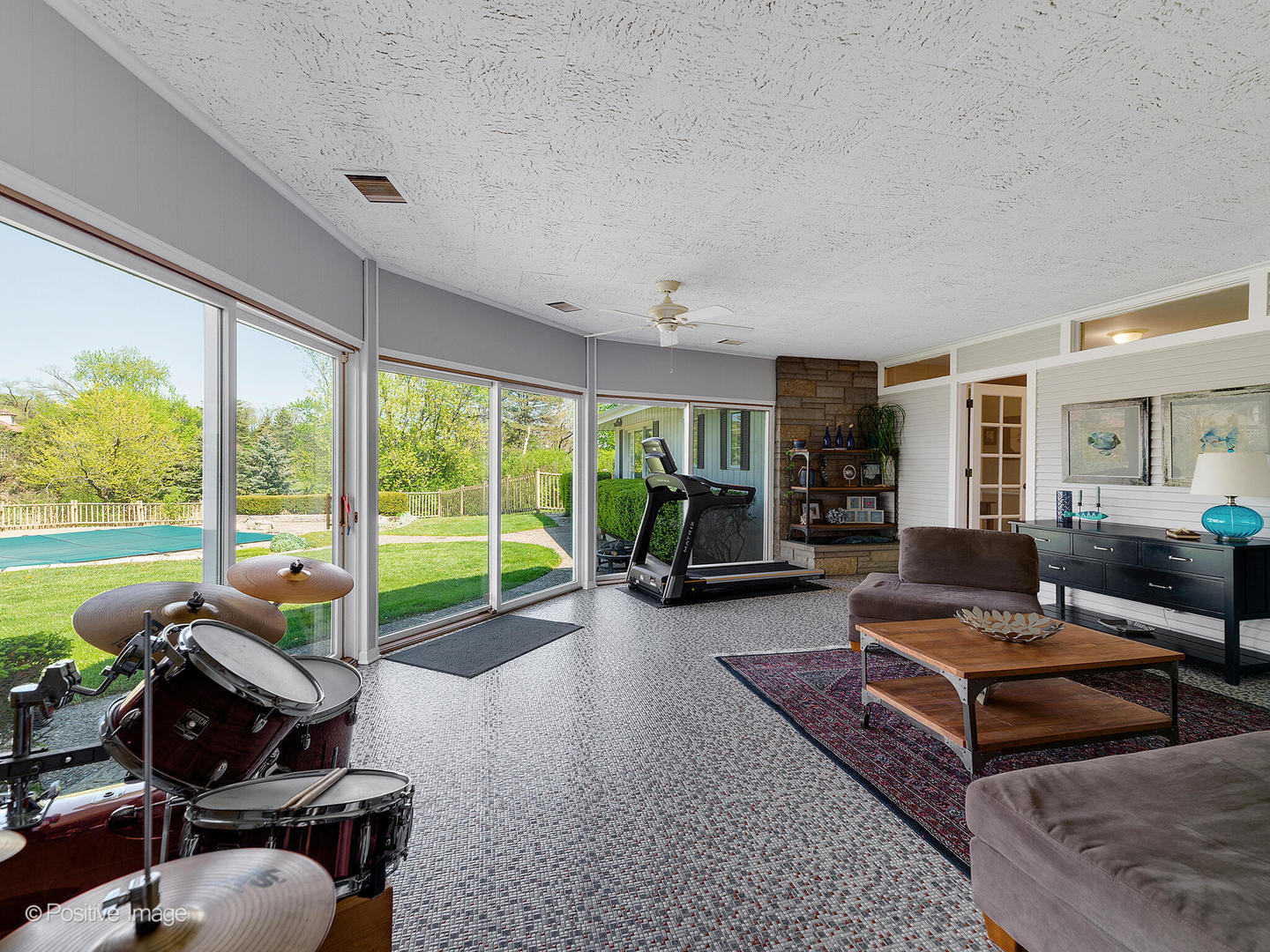 6401 South County Line Road Burr Ridge, IL 60527 - Photo 29 of 57 a living room with furniture and a floor to ceiling window