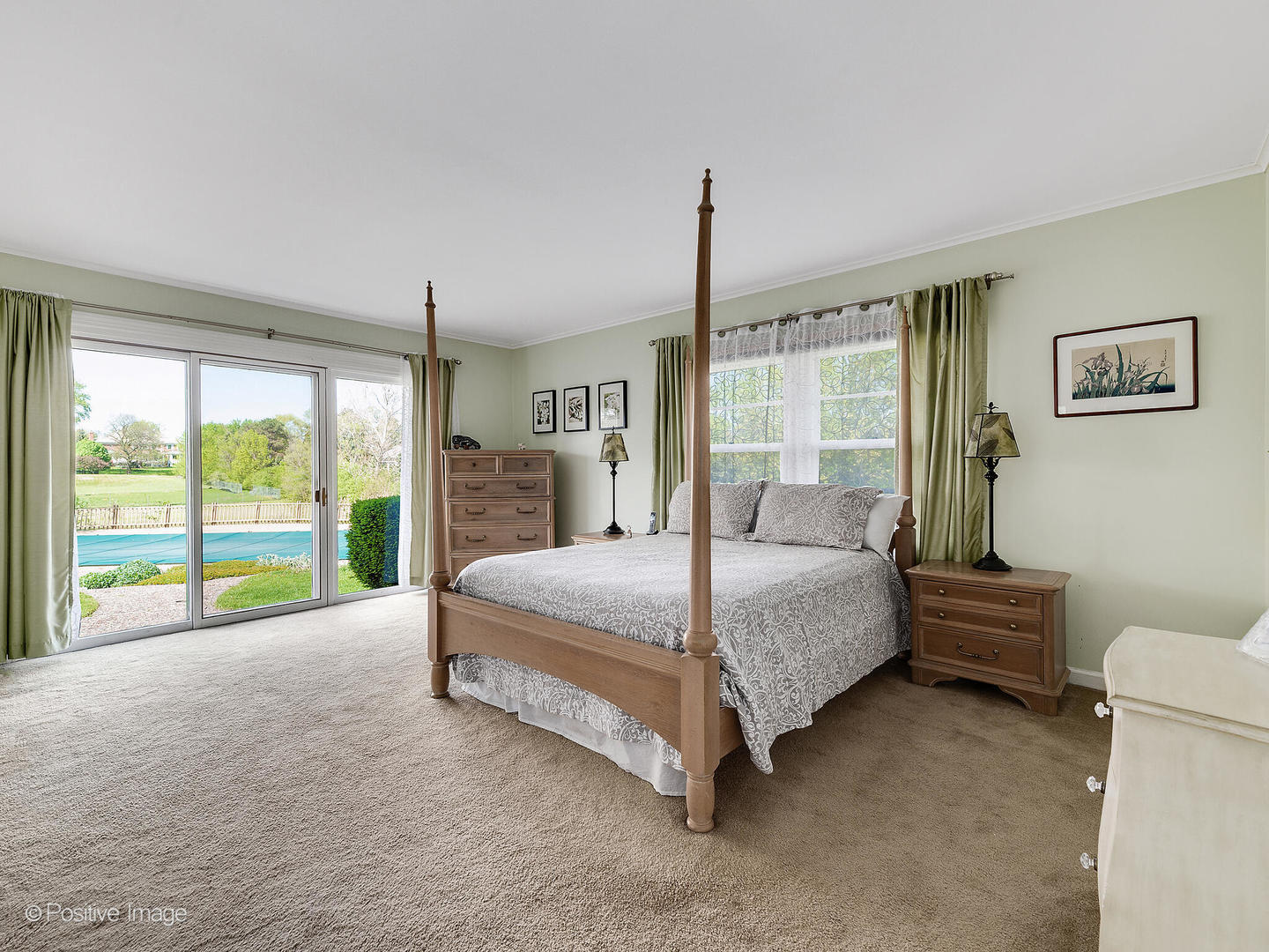 6401 South County Line Road Burr Ridge, IL 60527 - Photo 30 of 57 a spacious bedroom with a bed and a large window