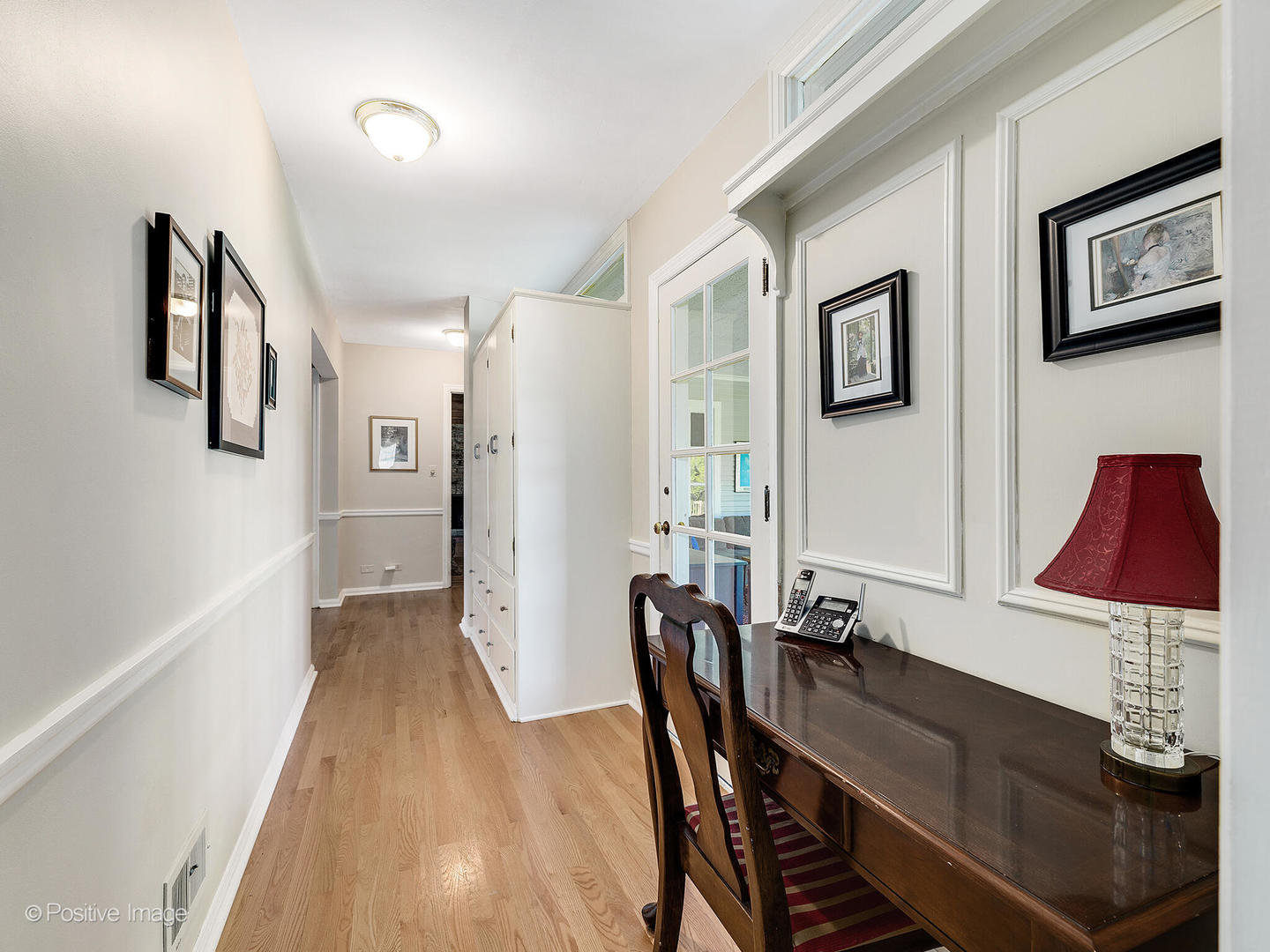 6401 South County Line Road Burr Ridge, IL 60527 - Photo 32 of 57 a view of a dining room with furniture a chandelier and wooden floor