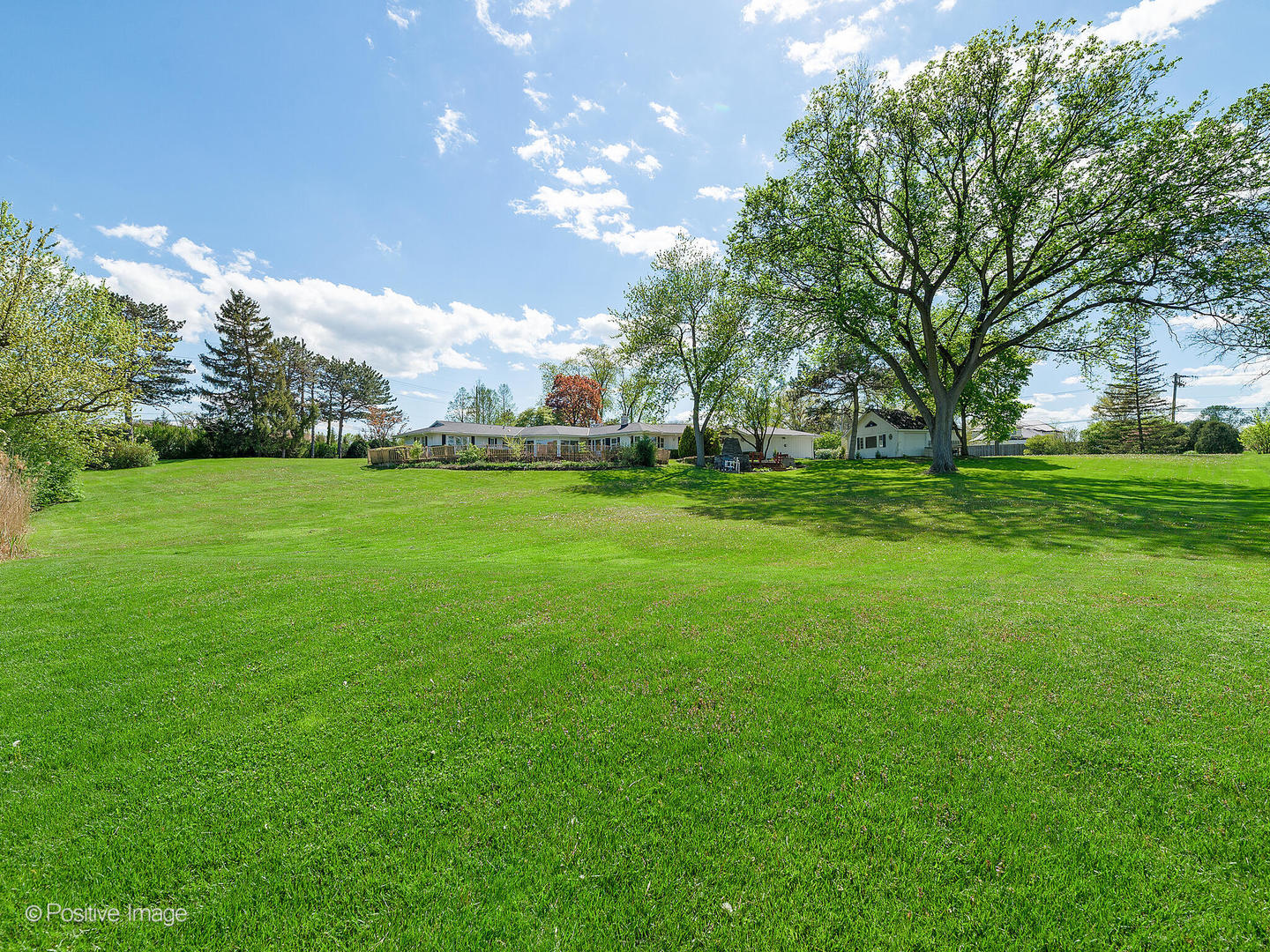 6401 South County Line Road Burr Ridge, IL 60527 - Photo 41 of 57 a backyard of a house with lots of green space and outdoor space