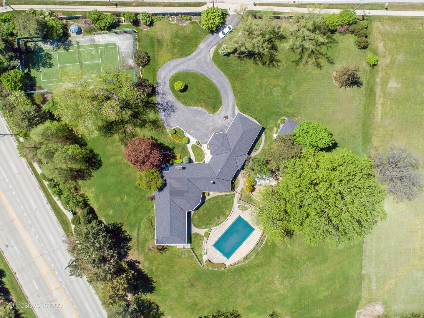 6401 South County Line Road Burr Ridge, IL 60527 - Photo 47 of 57 an aerial view of residential house with outdoor space and swimming pool