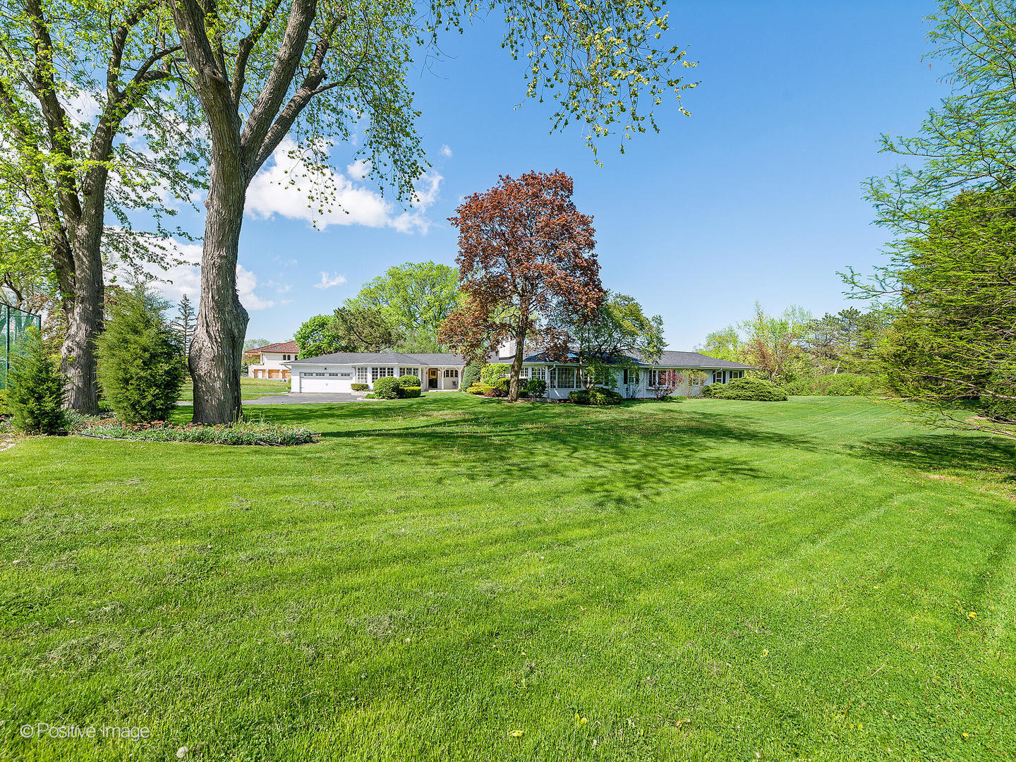 6401 South County Line Road Burr Ridge, IL 60527 - Photo 52 of 57 a backyard of a house with lots of green space and fountain