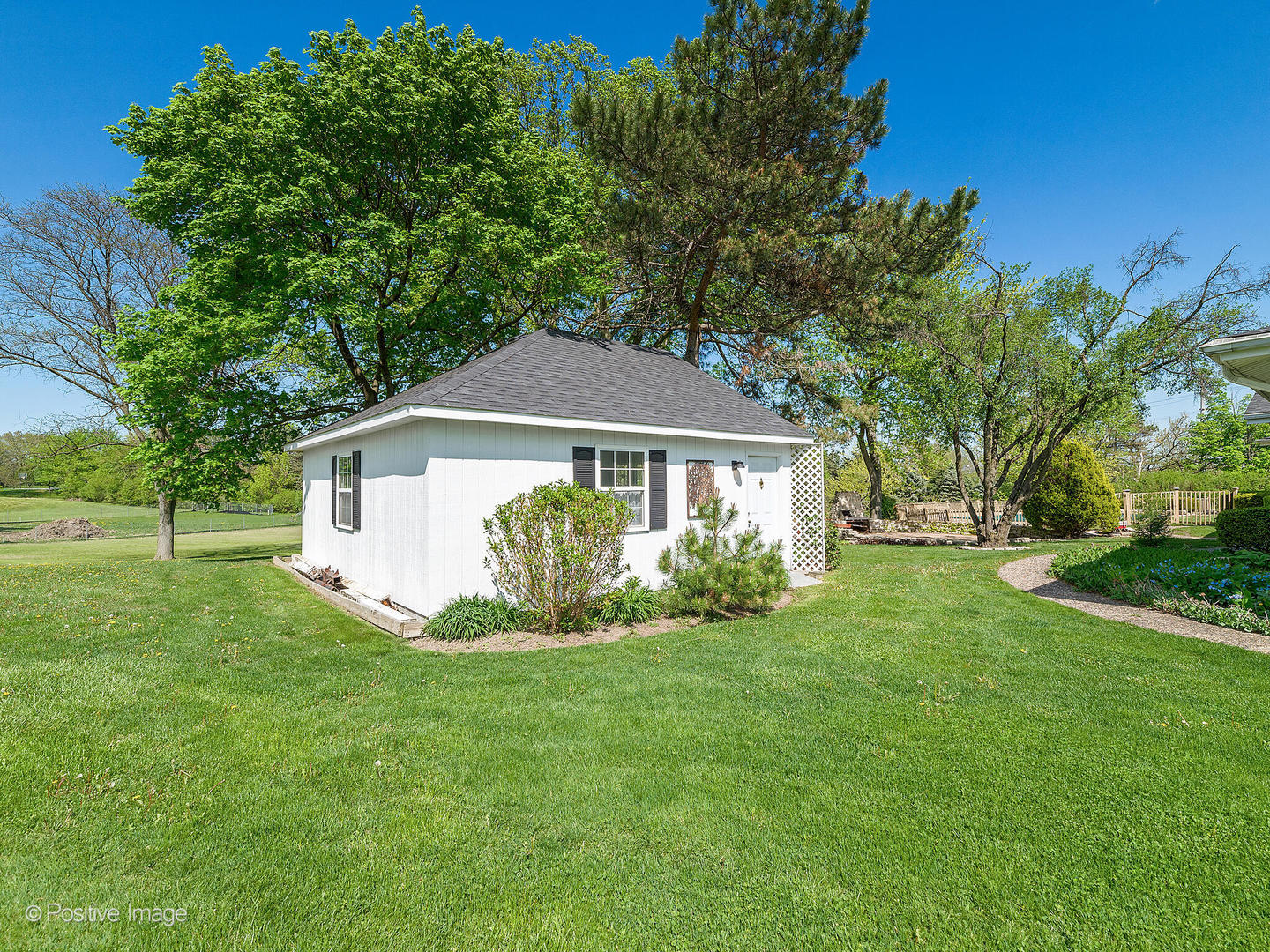 6401 South County Line Road Burr Ridge, IL 60527 - Photo 55 of 57 a front view of a house with a yard