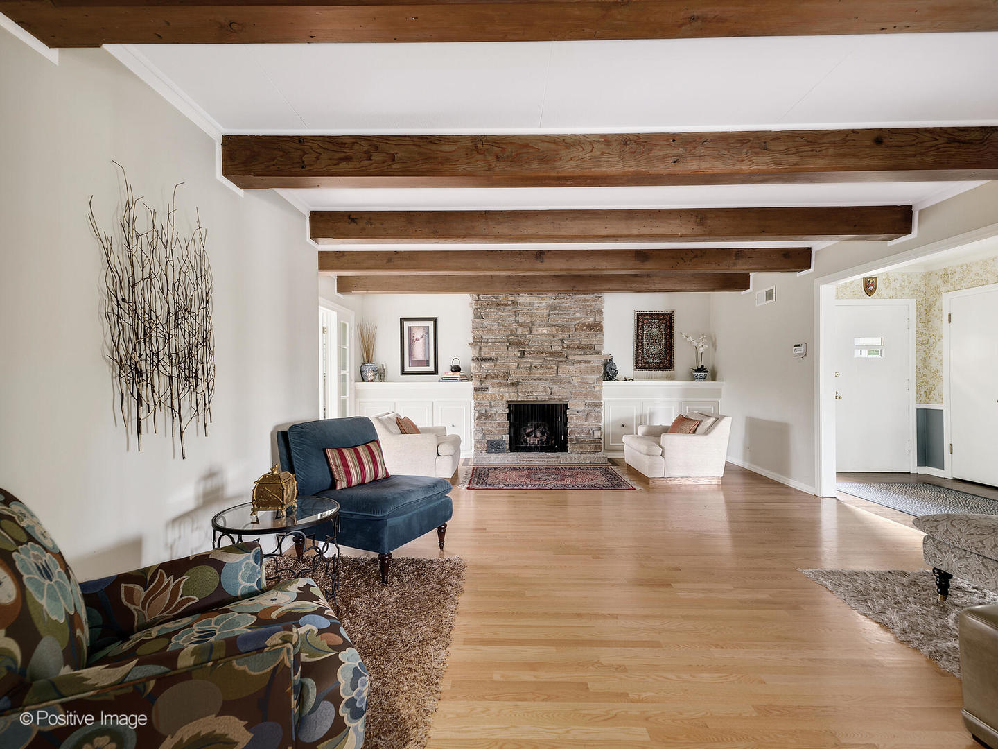 6401 South County Line Road Burr Ridge, IL 60527 - Photo 8 of 57 a living room with furniture and a fireplace