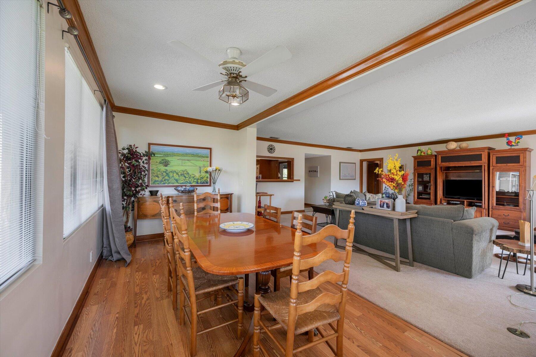 13244 Polo Club Road, Unit C207 Wellington, FL 33414 - Photo 31 of 31 a view of a dining room with furniture window and wooden floor