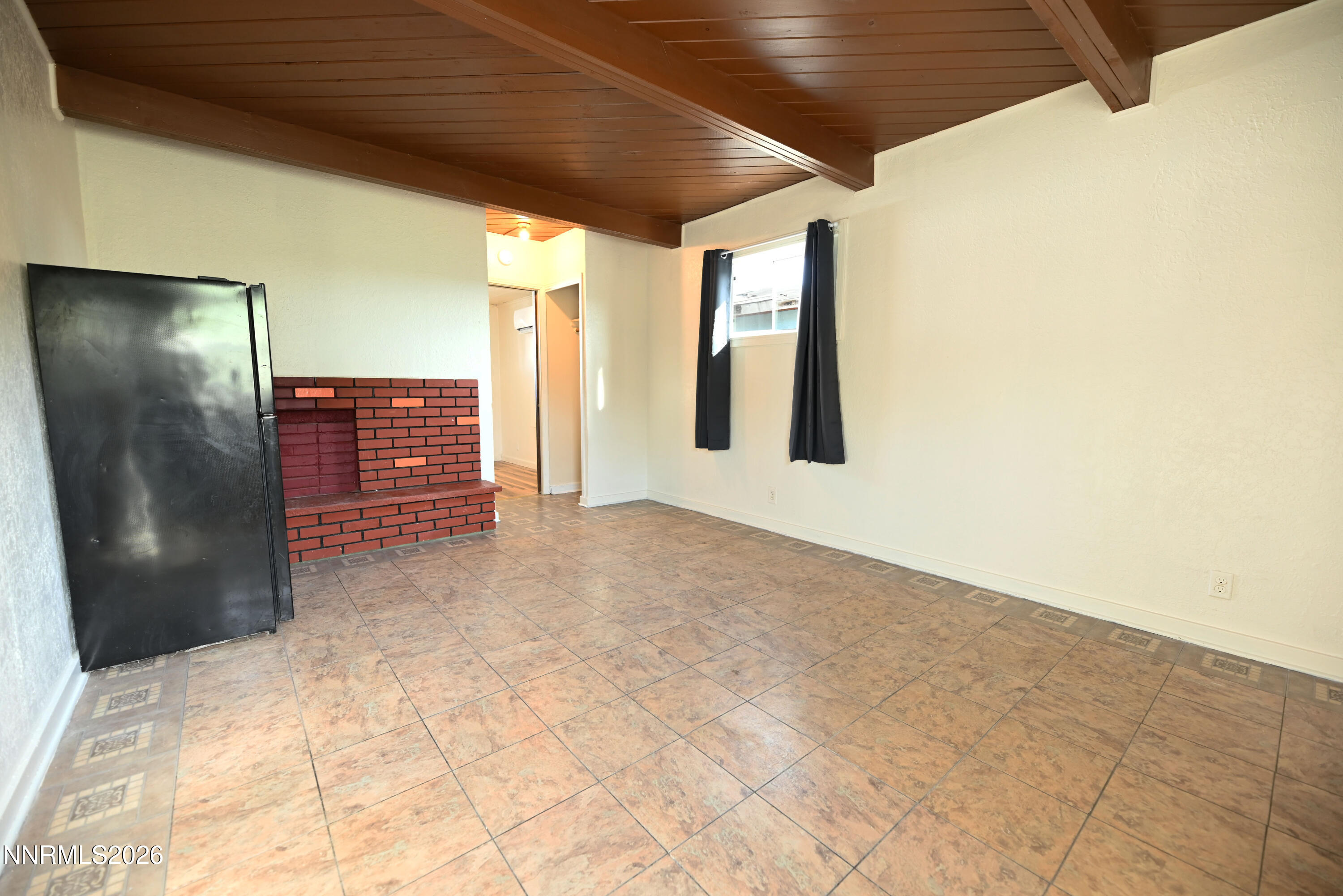 110 Harrison Street Hawthorne, NV 89415 - Photo 12 of 30 a view of an empty room with a window