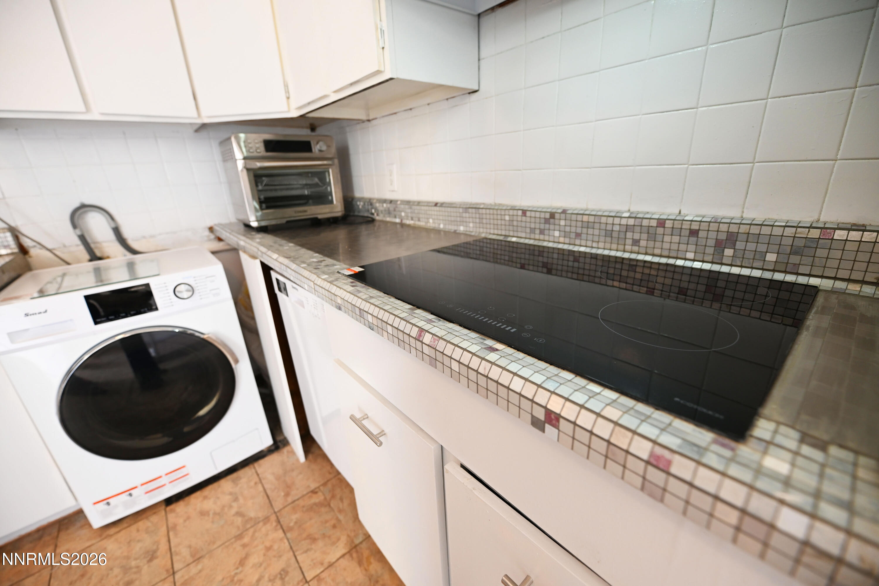 110 Harrison Street Hawthorne, NV 89415 - Photo 17 of 30 a close view of a sink and dishwasher in kitchen