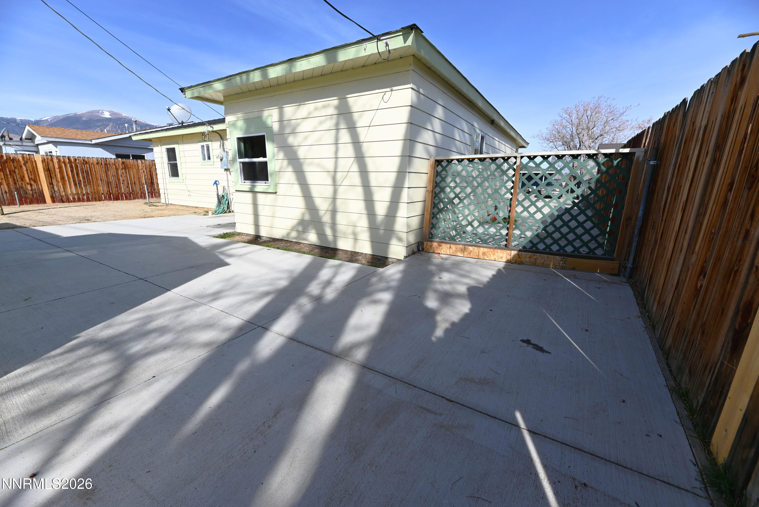 110 Harrison Street Hawthorne, NV 89415 - Photo 24 of 30 a view of a house with a backyard