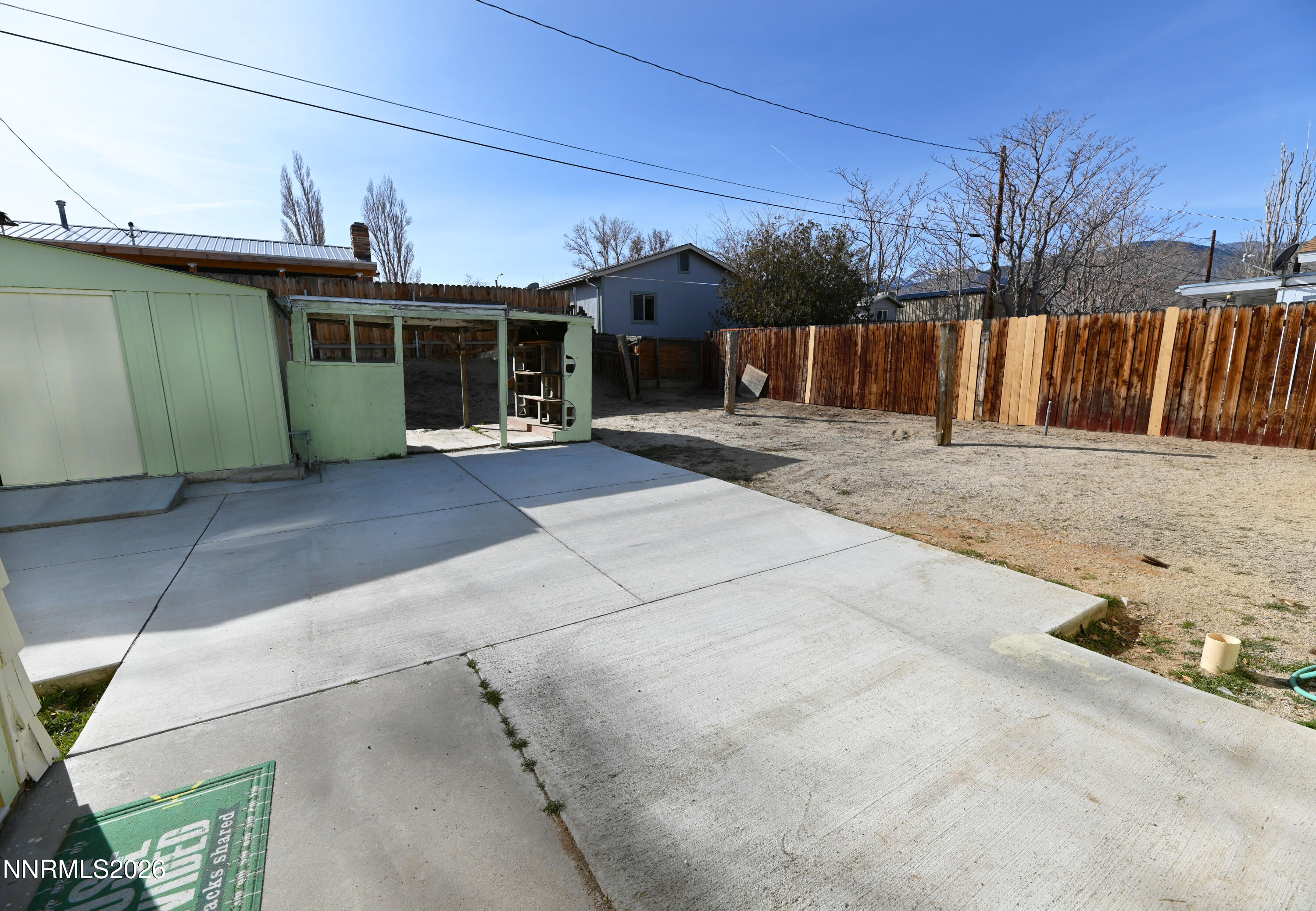 110 Harrison Street Hawthorne, NV 89415 - Photo 25 of 30 a front view of a house with a yard and garage