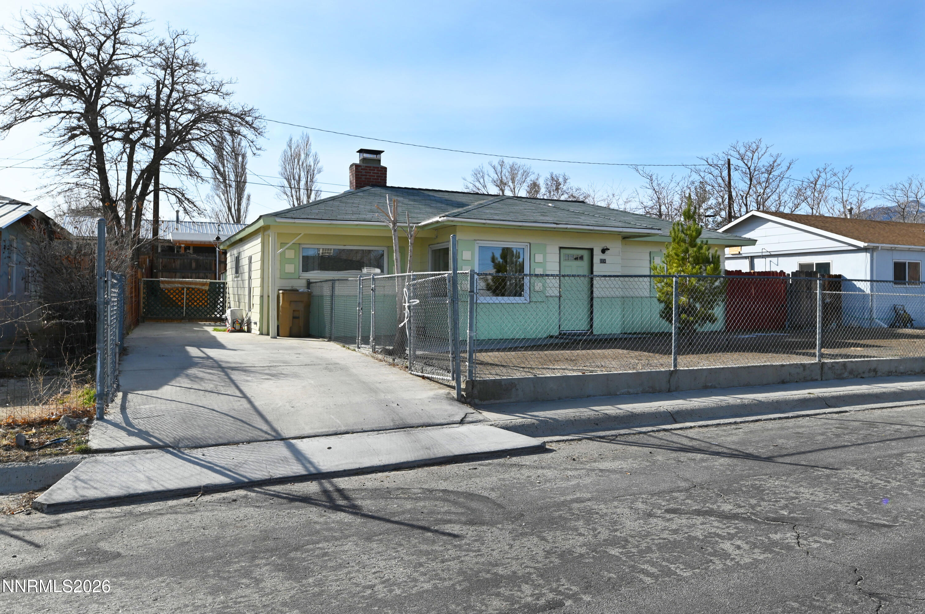 110 Harrison Street Hawthorne, NV 89415 - Photo 3 of 30 a front view of a house with garden