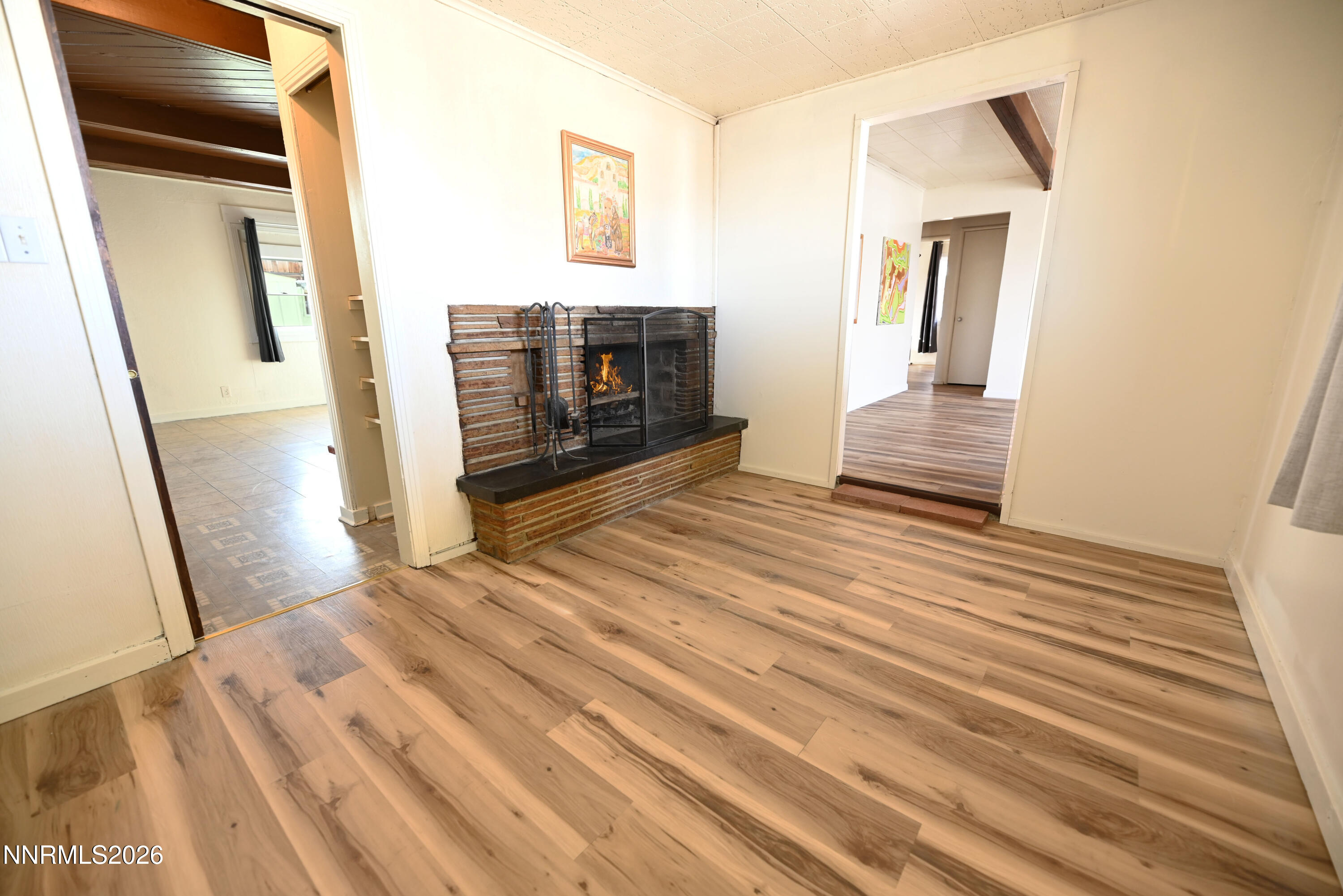 110 Harrison Street Hawthorne, NV 89415 - Photo 10 of 30 a view of a livingroom with wooden floor and staircase
