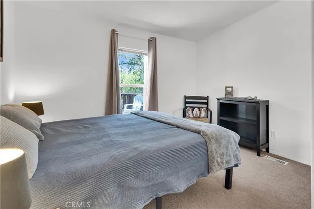 a bedroom with a bed and window