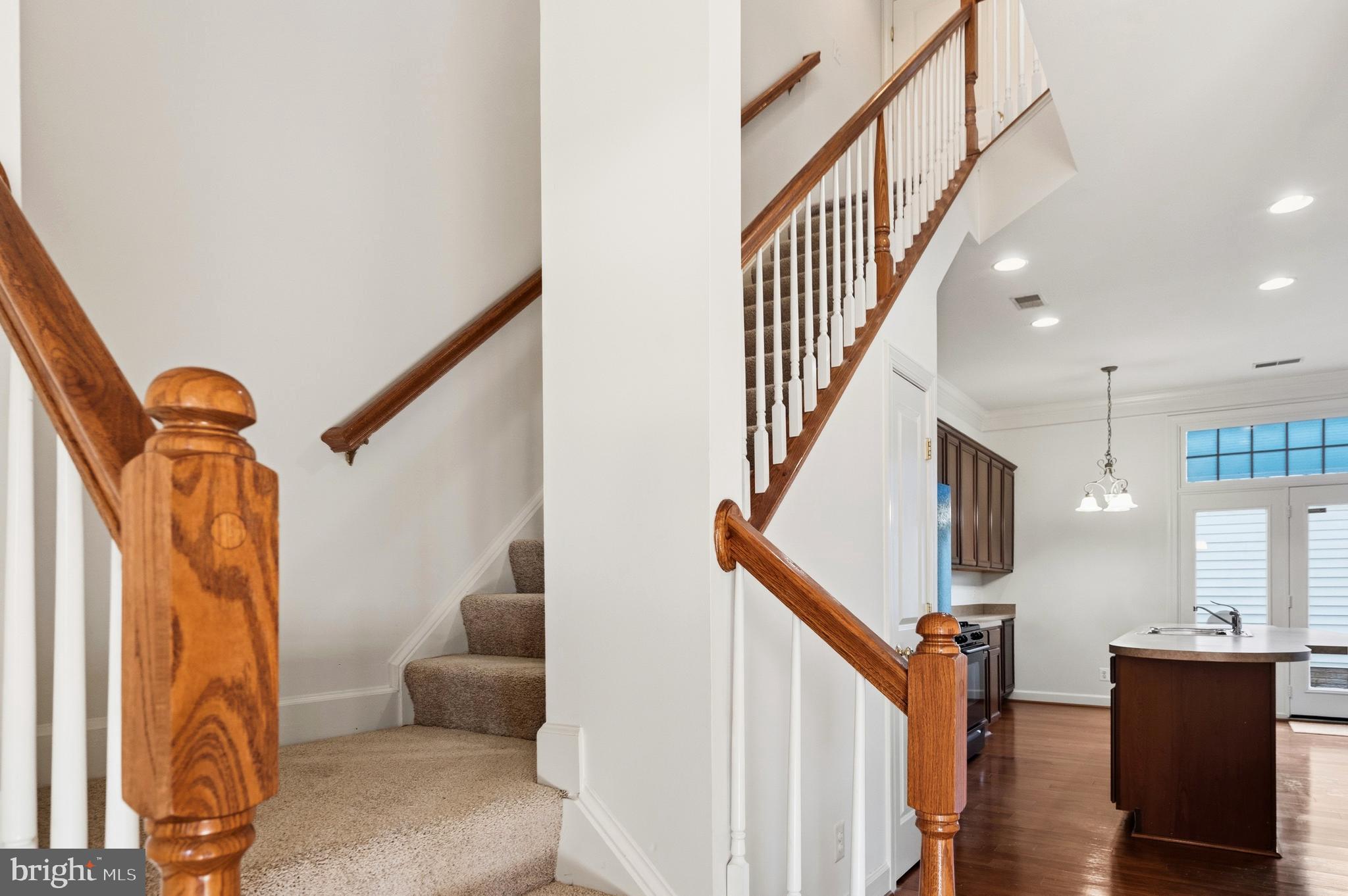 9227 Ribbon Falls Loop Bristow, VA 20136 - Photo 7 of 53 a view of entryway and hall with wooden floor