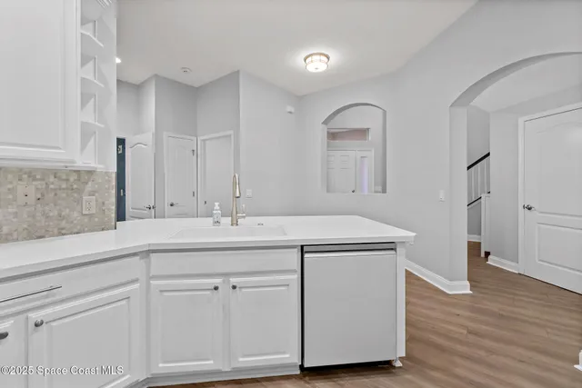 a utility room with cabinets