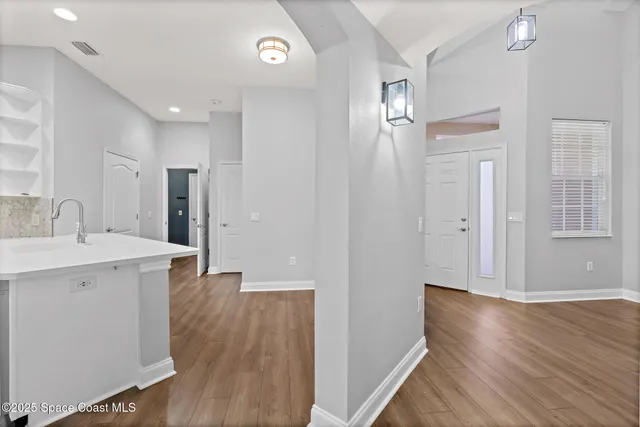 a view of a kitchen from the hallway