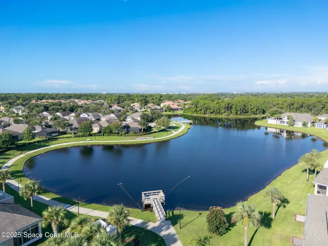 a view of a lake with houses in the back
