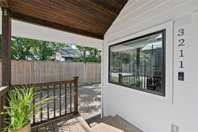 a view of a porch with wooden floor