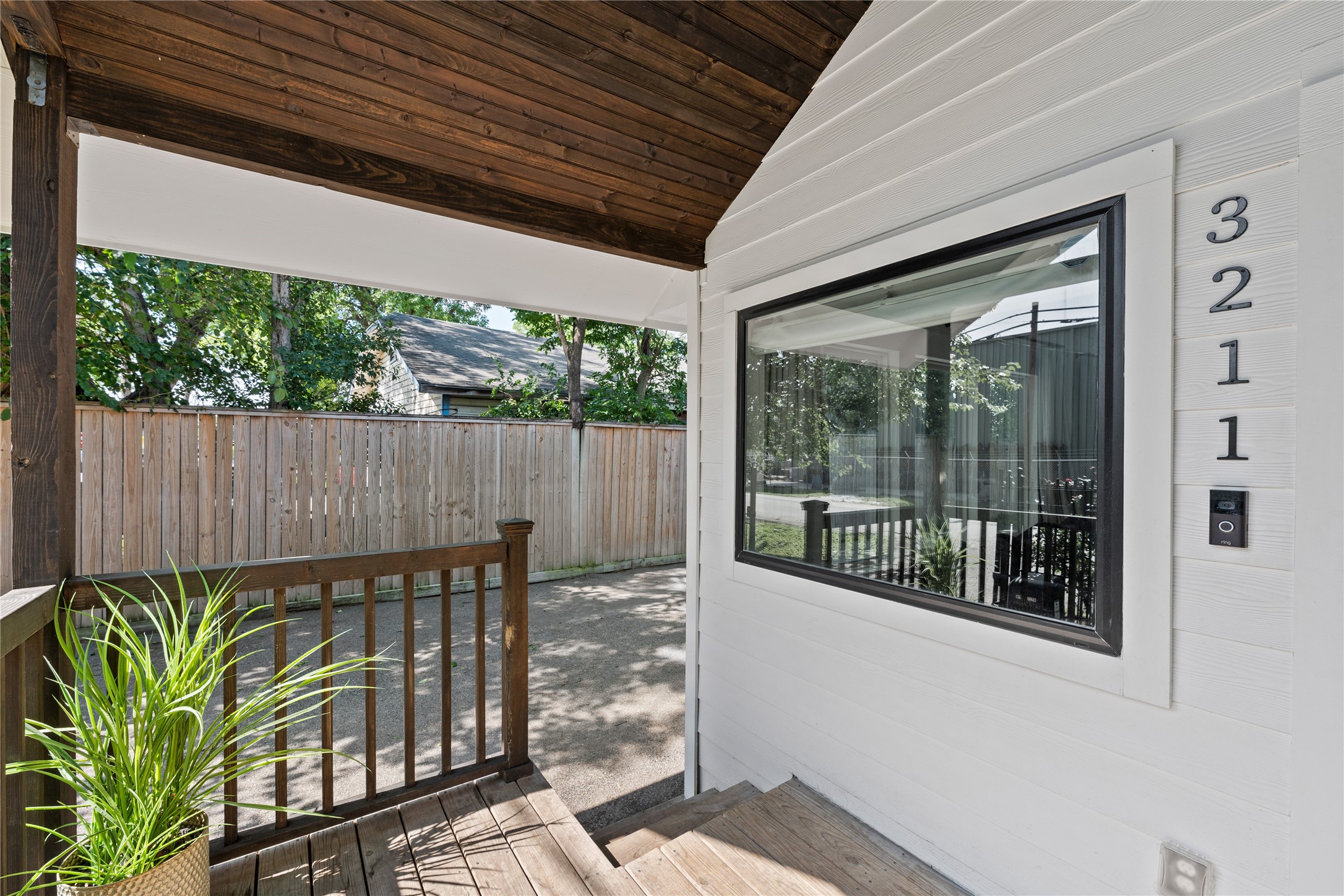 a view of a porch with wooden floor