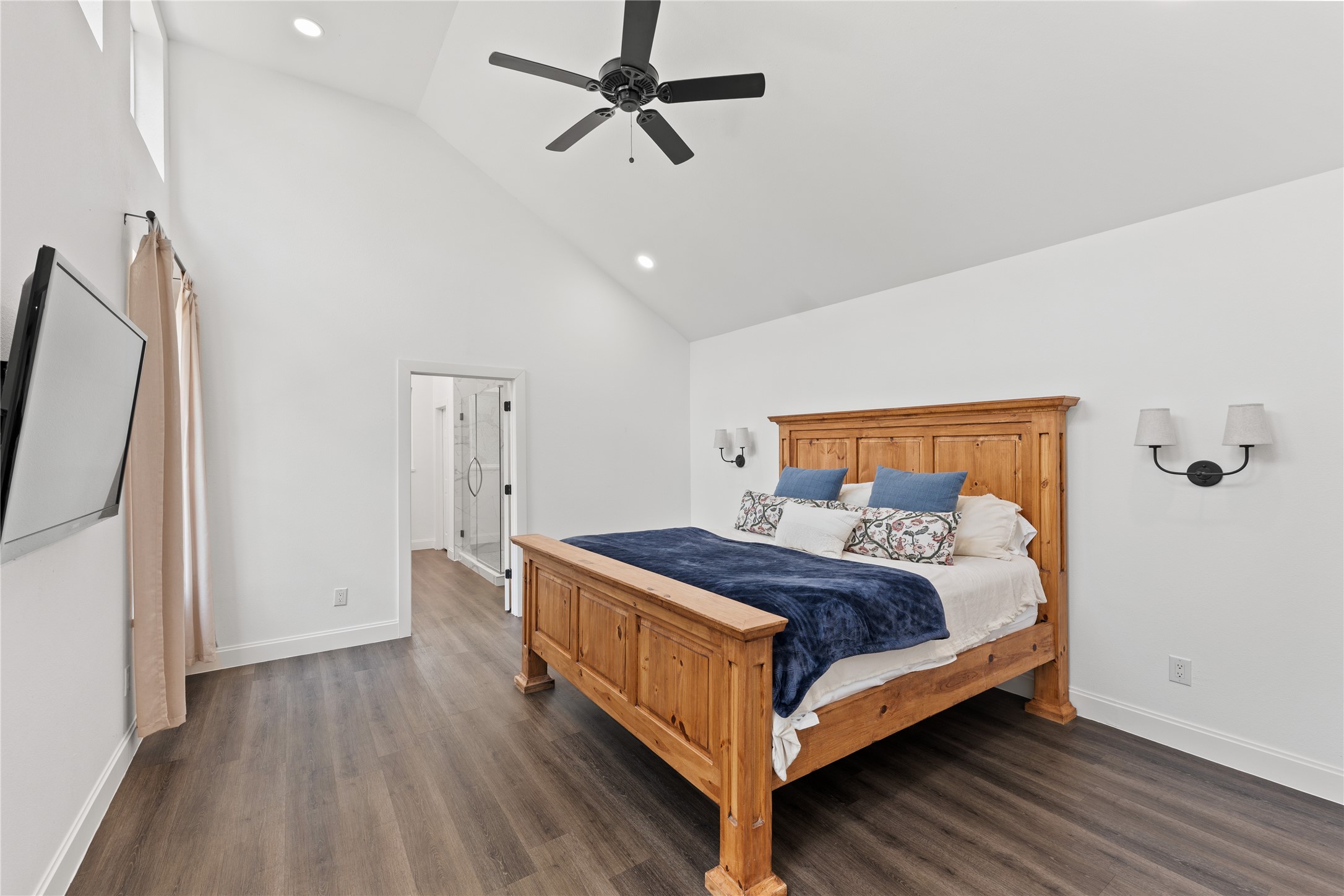 3211 Cochran Street Houston, TX 77009 - Photo 12 of 32 a bedroom with a bed and wooden floor
