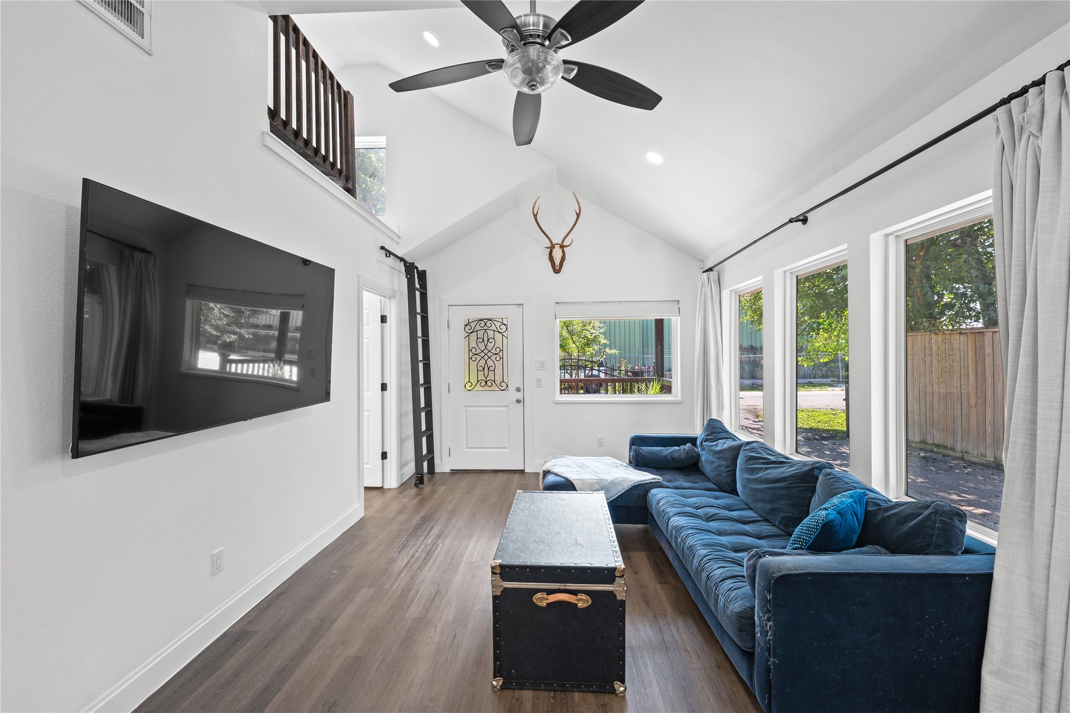 3211 Cochran Street Houston, TX 77009 - Photo 2 of 32 a living room with furniture and a flat screen tv