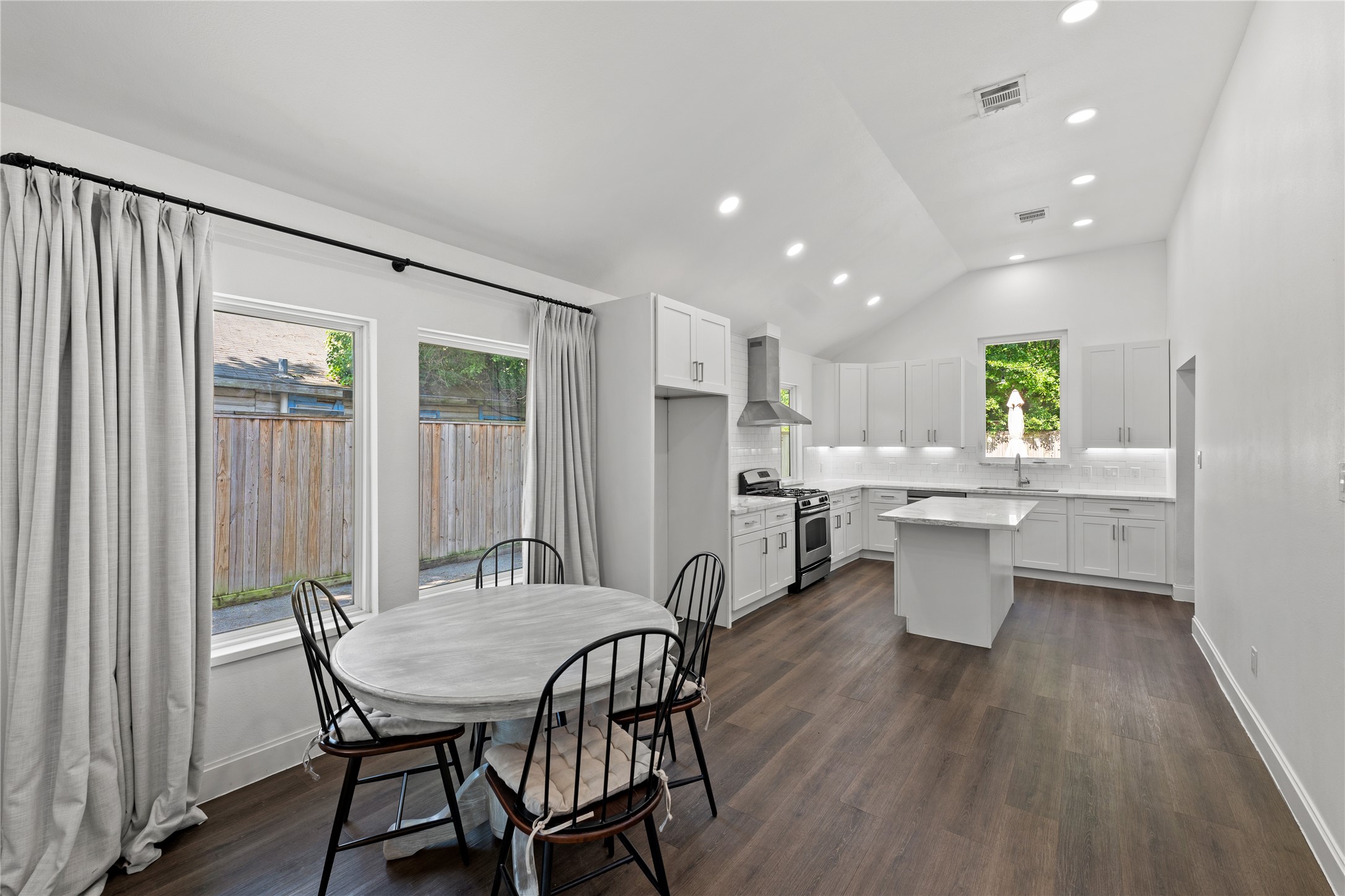 3211 Cochran Street Houston, TX 77009 - Photo 4 of 32 a view of a dining room with furniture and wooden floor