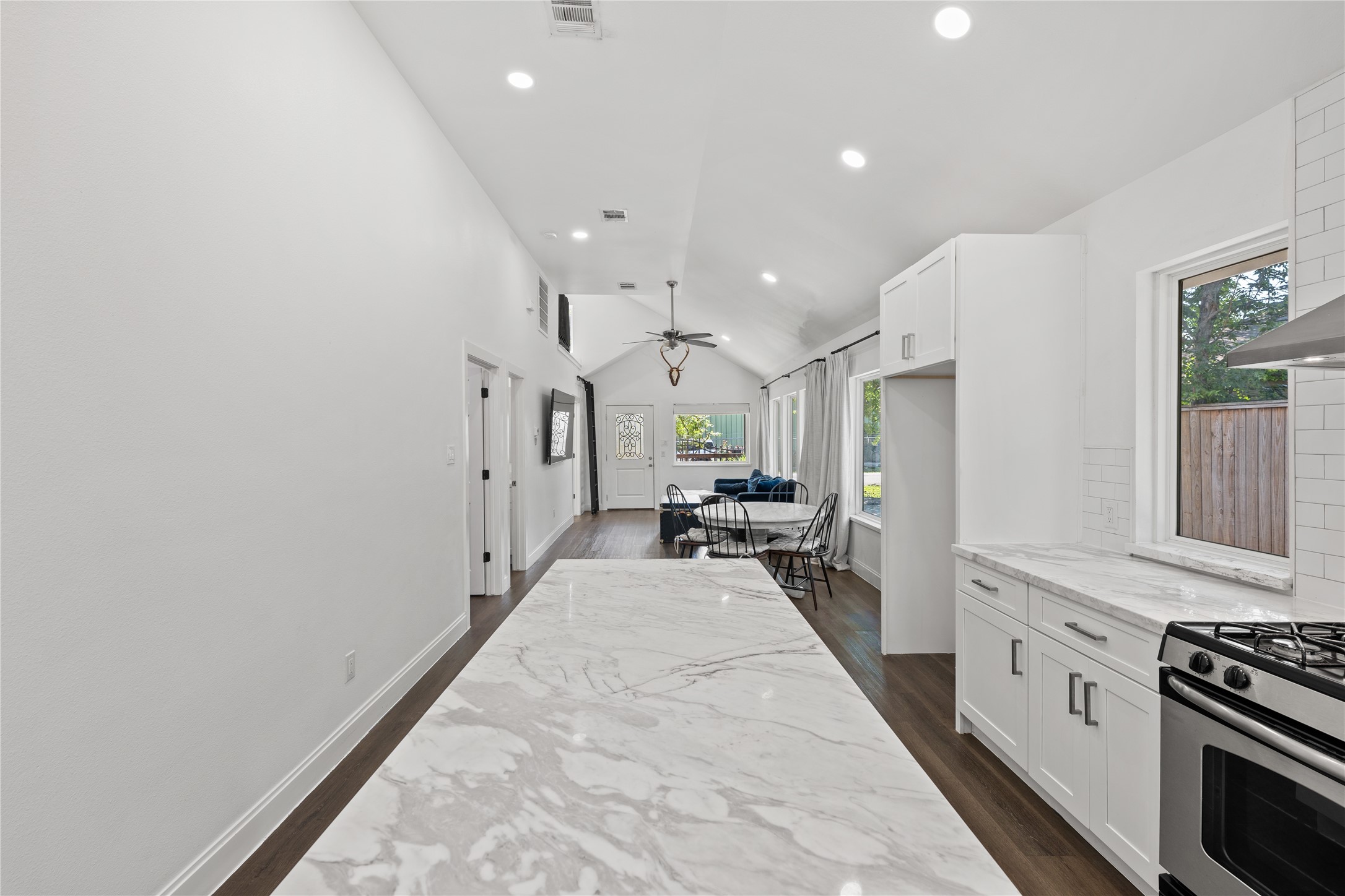 3211 Cochran Street Houston, TX 77009 - Photo 7 of 32 a kitchen with sink cabinets and stainless steel appliances