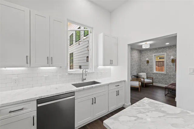 a kitchen with a sink and cabinets