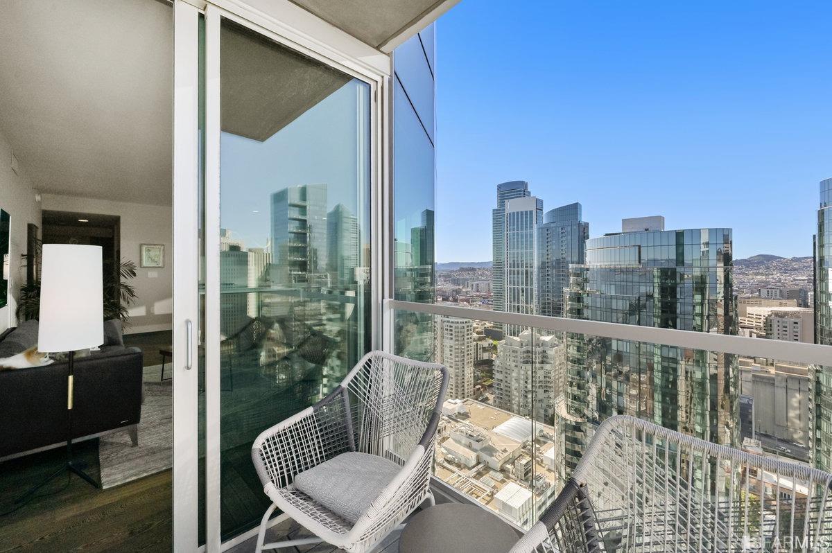 338 Spear Street, Unit 39E San Francisco, CA 94105 - Photo 14 of 97 a view of a balcony with chair and glass door