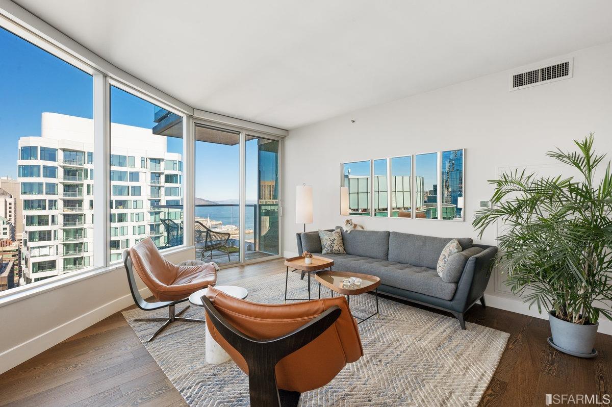 338 Spear Street, Unit 39E San Francisco, CA 94105 - Photo 2 of 97 a living room with furniture and a potted plant